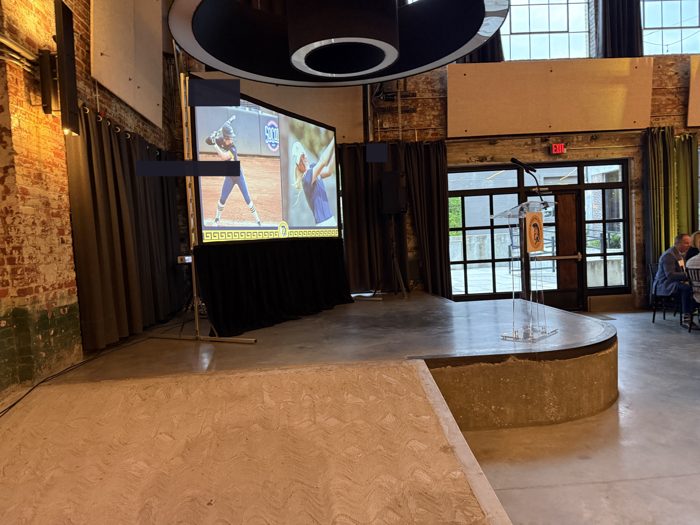 Presentation screen at a college athletics banquet