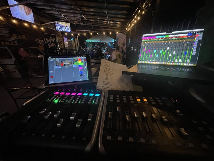 Live mixing console at an outdoor patio show