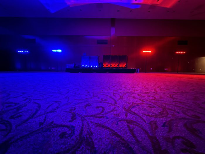Empty ballroom with red and blue dance-floor lighting